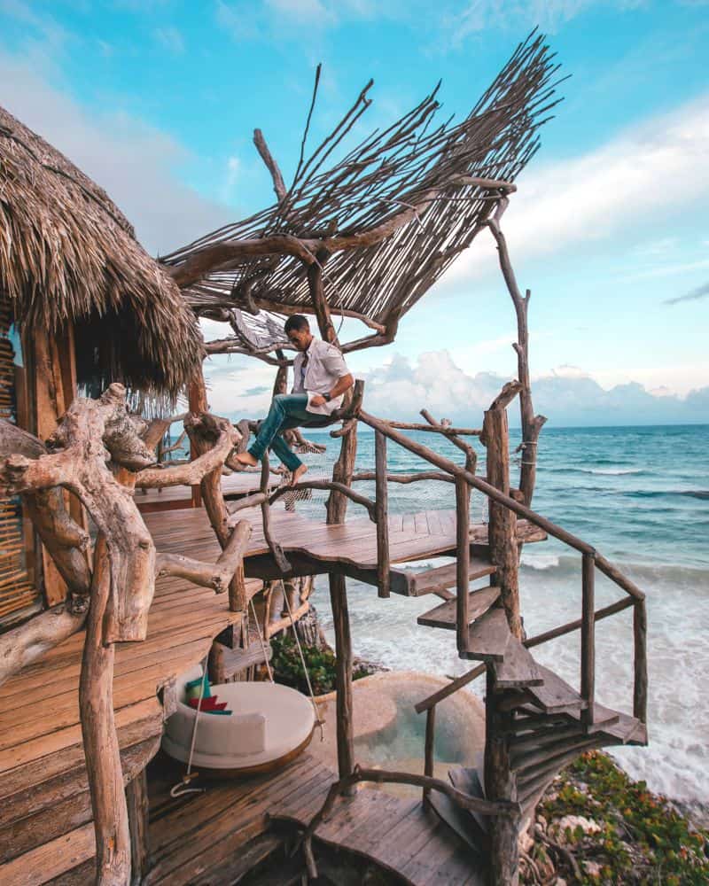 man sitting outside at Azulik Tulum resort in Mexico