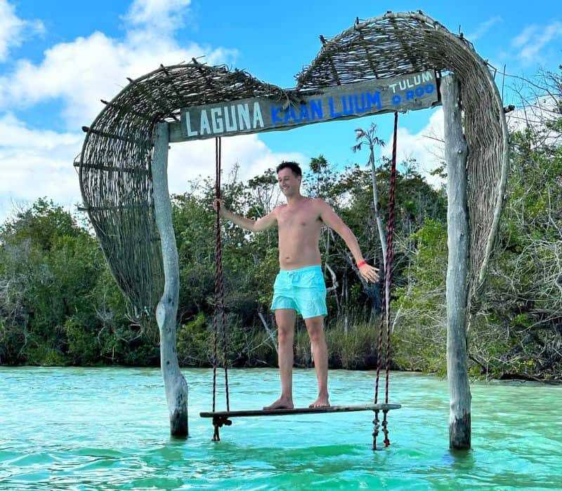man on the swings of laguna kaan luum