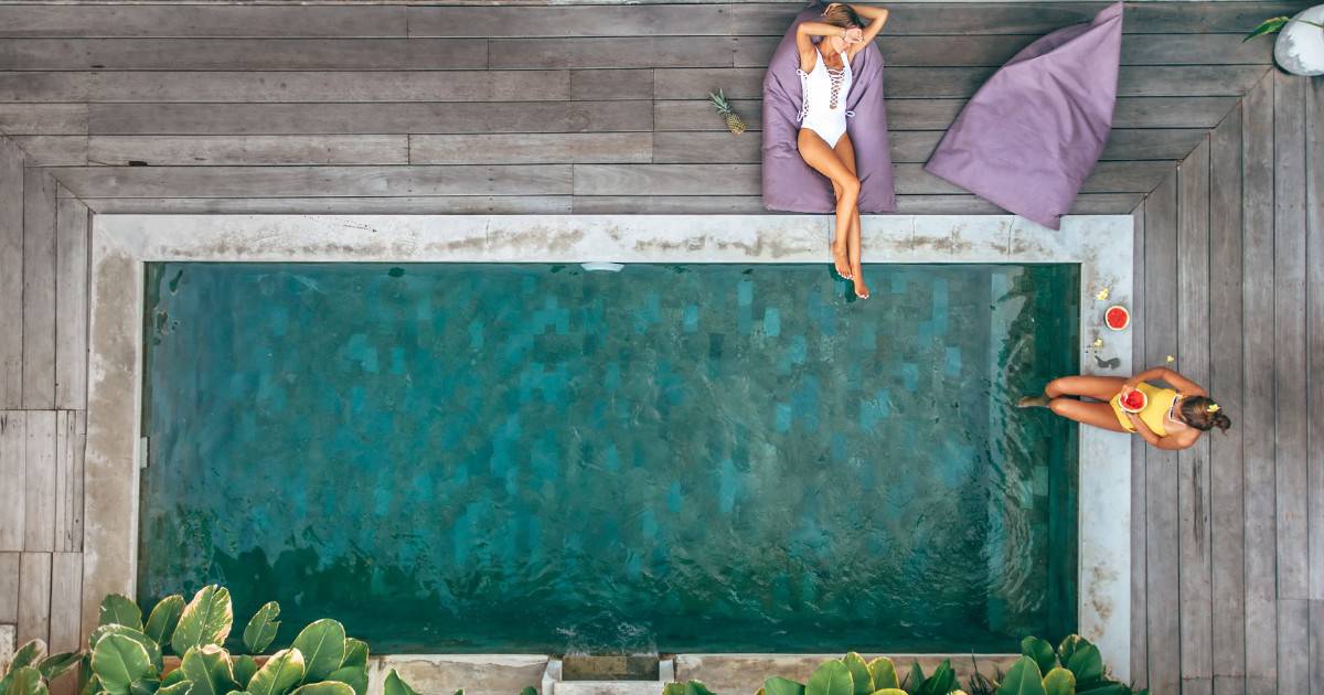 two girls hanging out by the pool - Tulum hotels with private pools