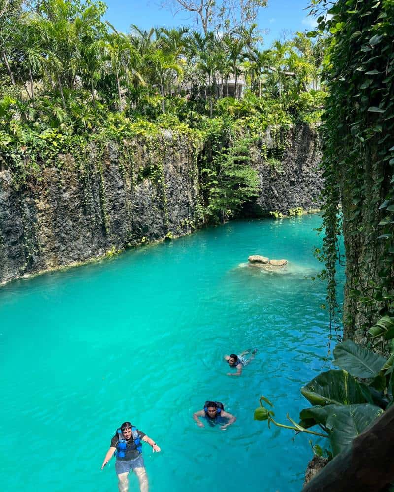people swimming in cenote atik tulum