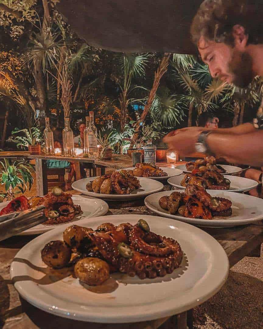 chef preparing a meal in the jungle, one of the best things to do in Tulum at night