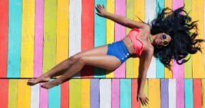 woman wearing colorful tulum outfits and laying down